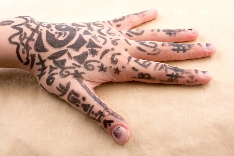 Hand with tattoo on a background
