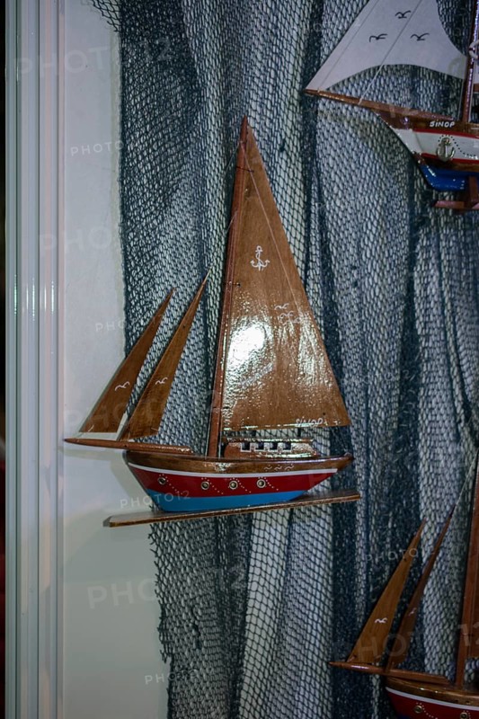 Mini size little colorful model sailboat in view
