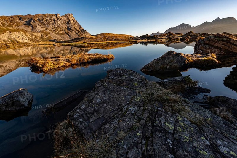 The Blue Lake at sunrise near Melchsee-Frutt on the Aa Alp in the Melch Valley