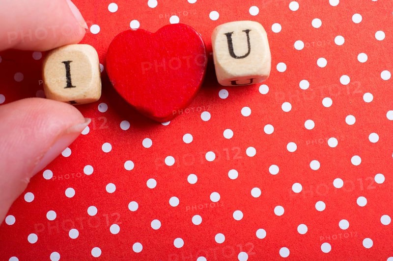 Phrase I Love You Made from Letter Cubes in in hand