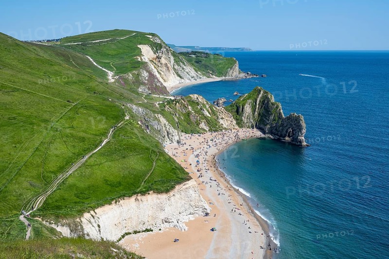 View over the chalk coast with the famous rock bridge Durdledoor