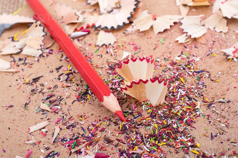 Red Color Pencil over some pencil shavings