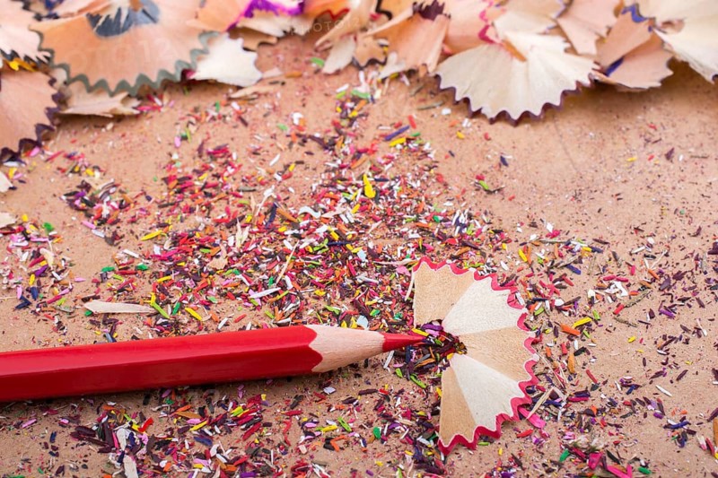 Red Color Pencil over some pencil shavings