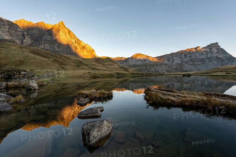 The Blue Lake at sunrise near Melchsee-Frutt on the Aa Alp in the Melch Valley