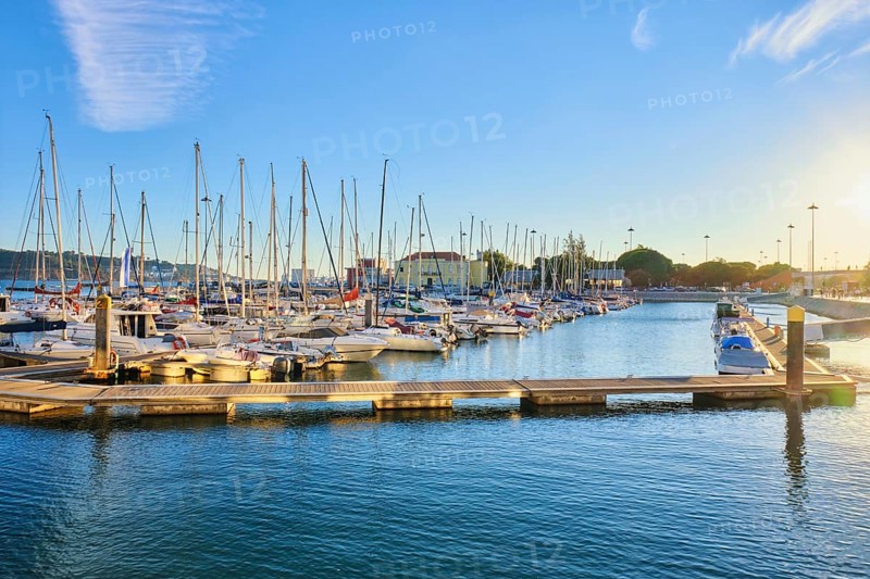 Lisbon marina on Tagus river with moored yachts and boats on sunset. Belem