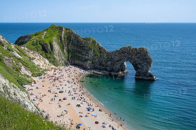 Bathing beach at the famous rock bridge Durdledoor