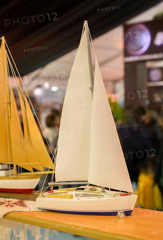 Mini size little colorful model sailboat in view