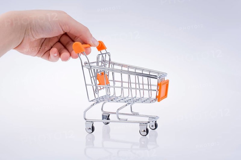 Hand holding a Cart on a white background