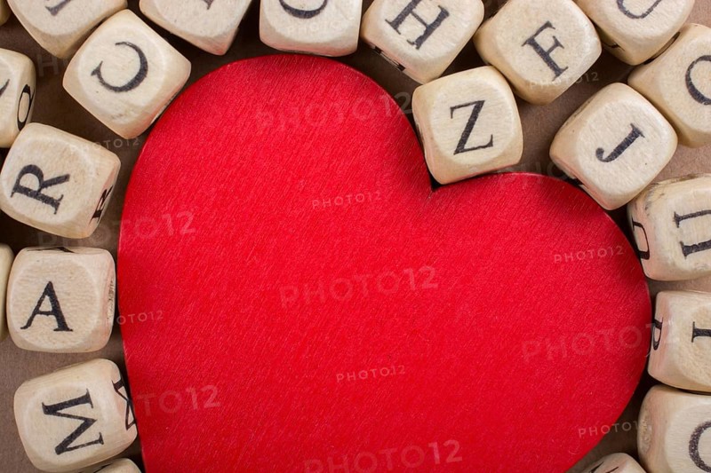Red Love icon and Letter cubes of made of wood