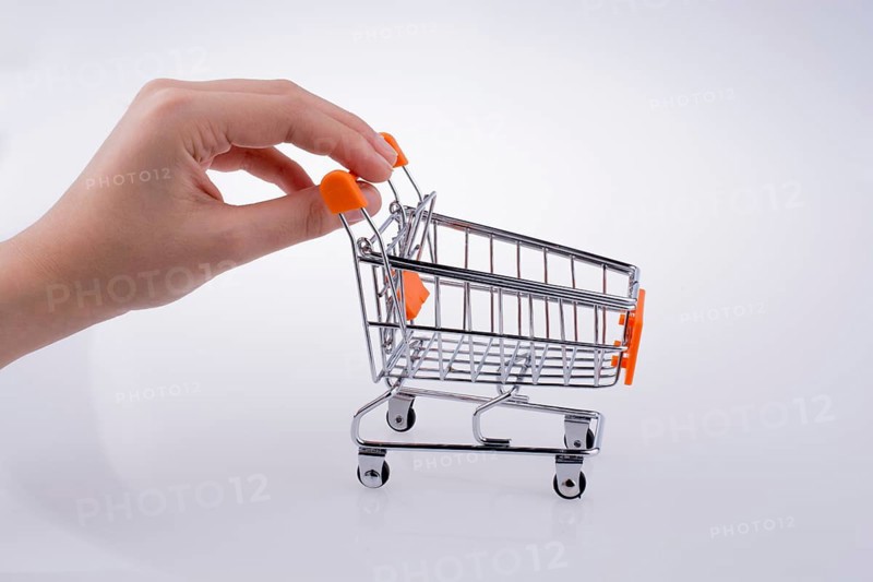 Hand holding a Cart on a white background