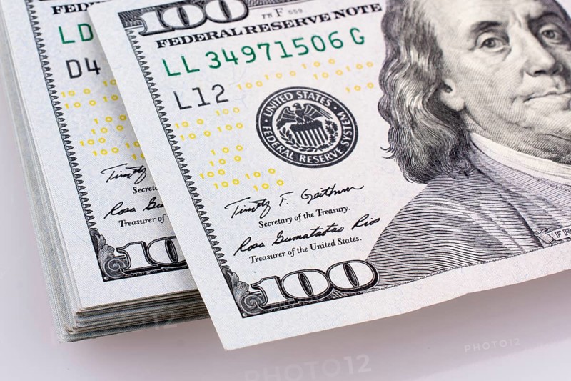 American 100 dollar banknotes made of paper placed on white background
