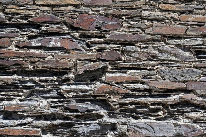 Slate slabs stacked to form a house wall