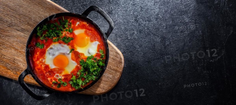 Shakshouka dish in a cast iron pan