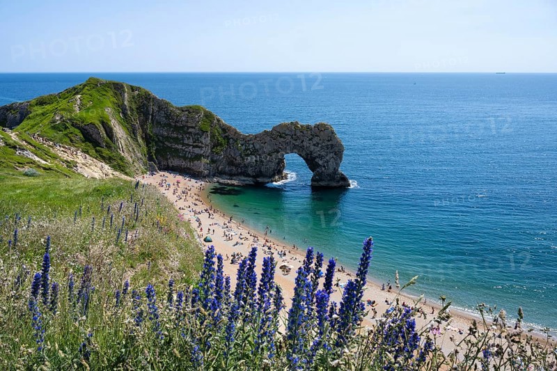 Bathing beach at the famous rock bridge Durdledoor