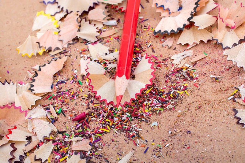 Red Color Pencil over some pencil shavings