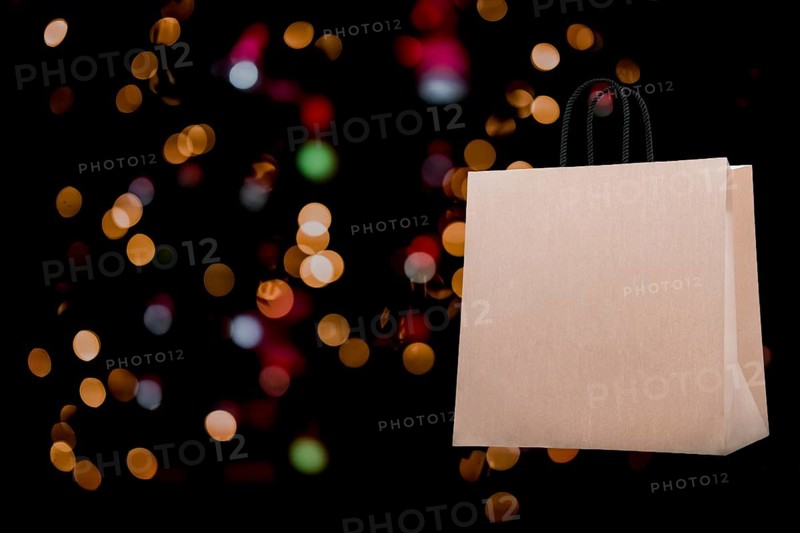 Template. Shopping bag on bokeh background