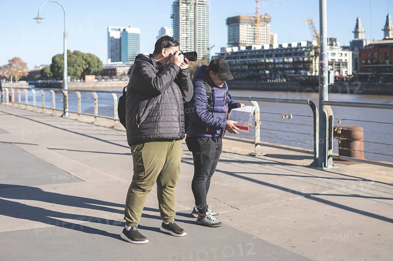 Couple of friends exploring Puerto Madero