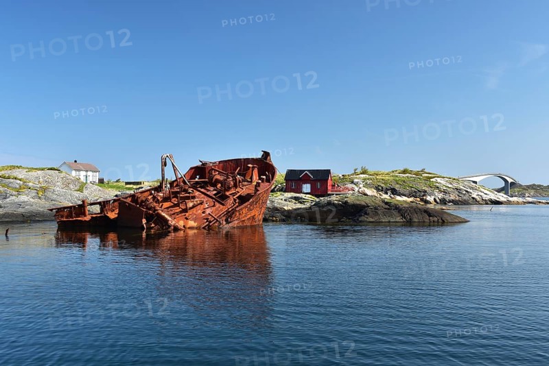 Rusty shipwreck on the Atlantic Strait in Norway