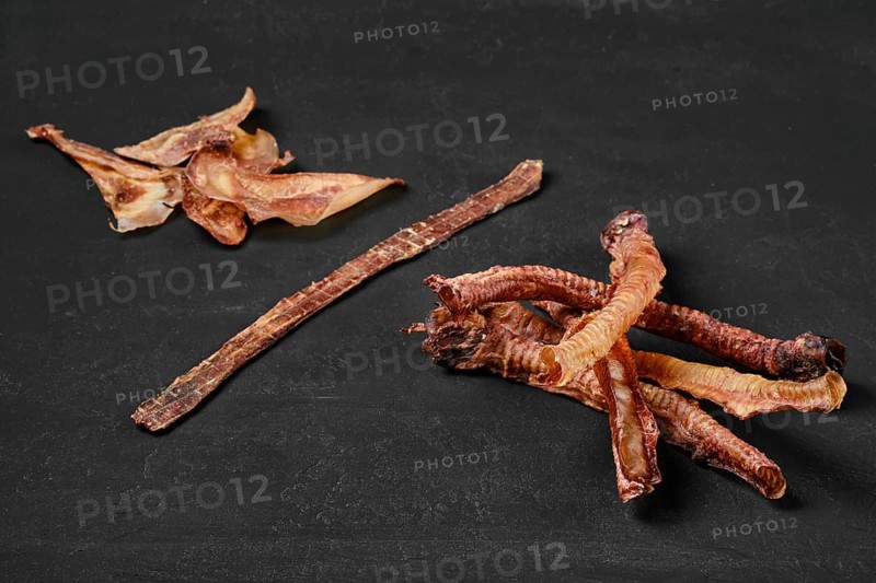 Assortment of natural dried treats for dogs. Dried meat products for dogs