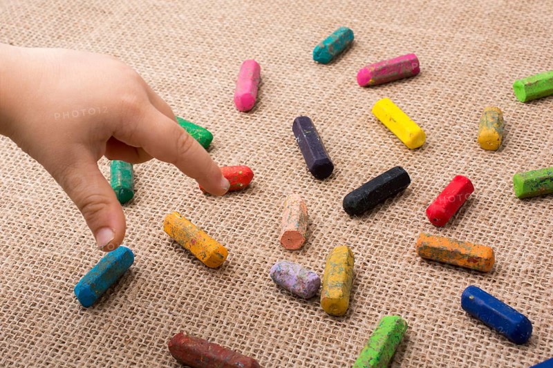 Used color crayons and a toddlers hand pointing