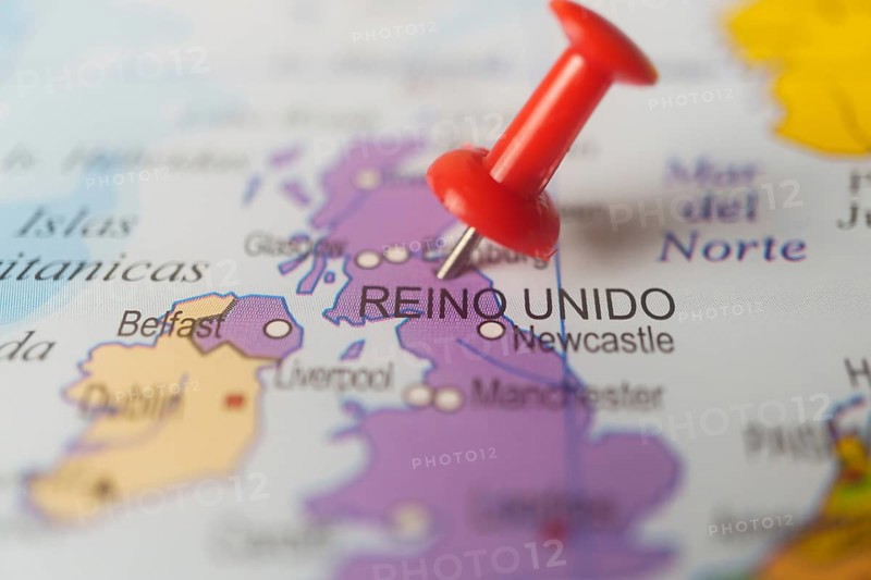 United kingdom marked with a red thumbtack on a map with an out-of-focus background