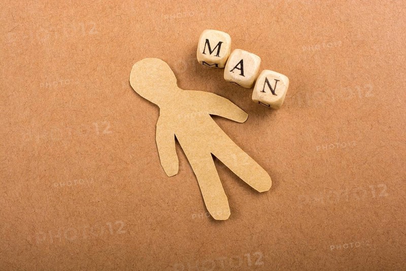 Paper man and man wording with letter cubes on paper