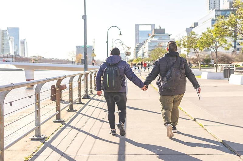 Tourist gay couple exploring Puerto Madero