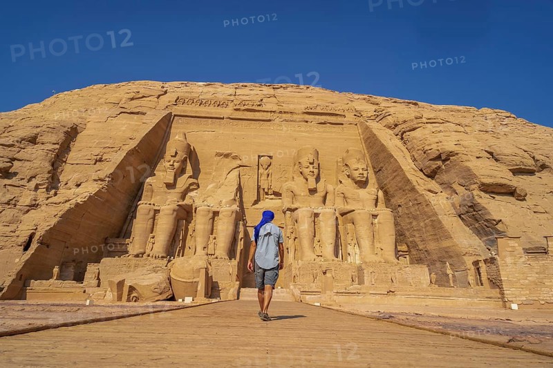 A European tourist visiting the Abu Simbel Temple in southern Egypt in Nubia next to Lake Nasser. Temple of Pharaoh Ramses II