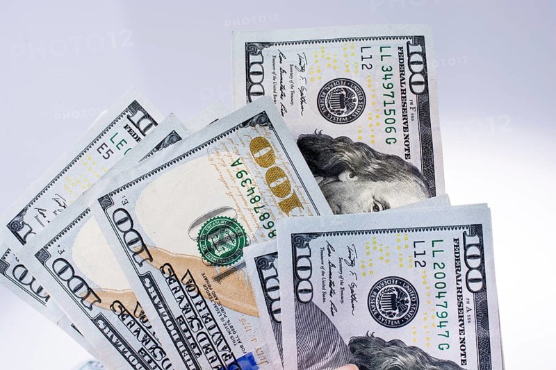 American 100 dollar banknotes made of paper placed on white background