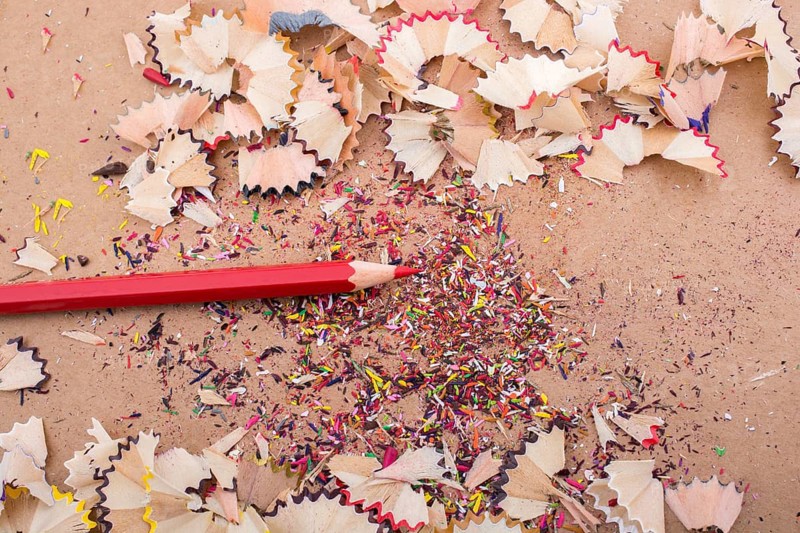Red Color Pencil over some pencil shavings