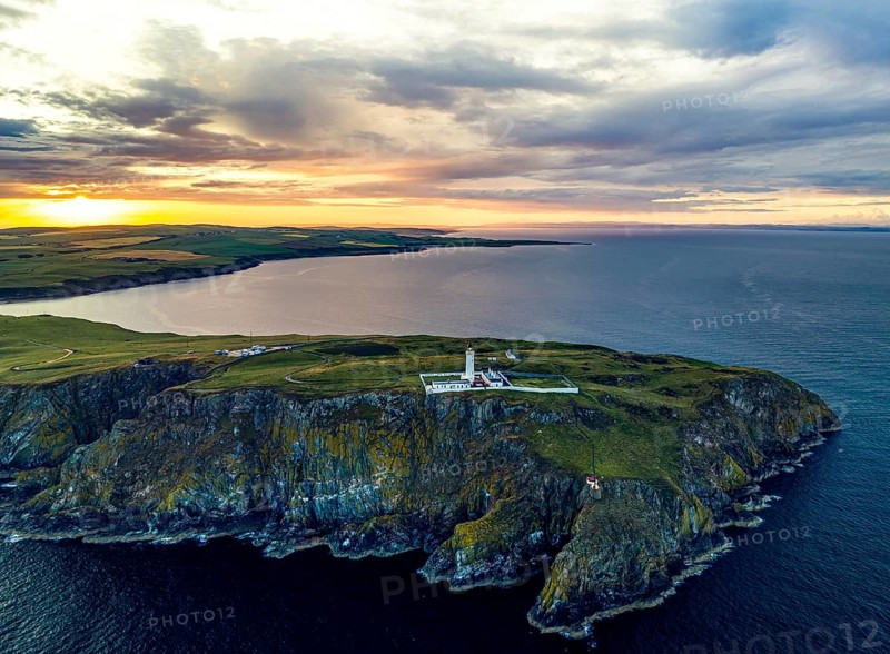 Sunset over Mull of Galloway Lighthouse from a drone