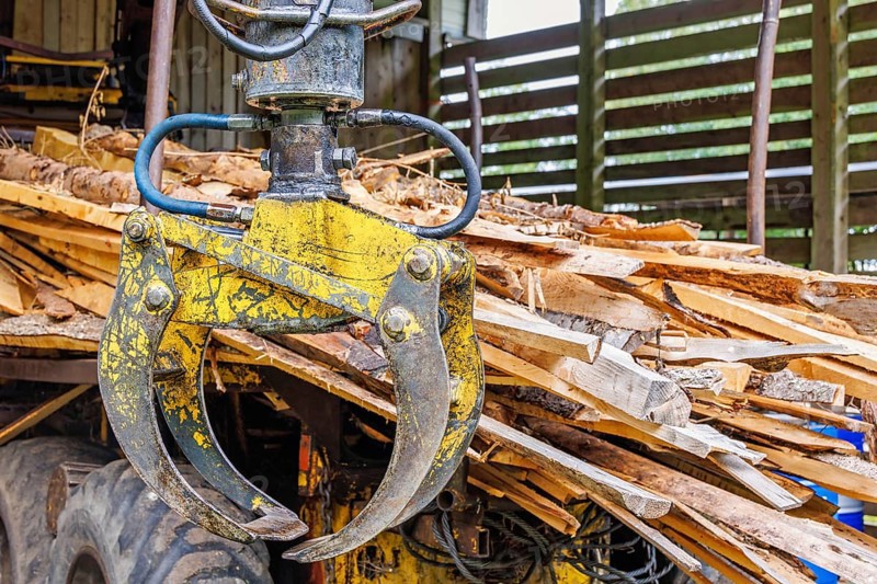 Hydraulic Crane on a forestry vehicle forwarder to lifting logs