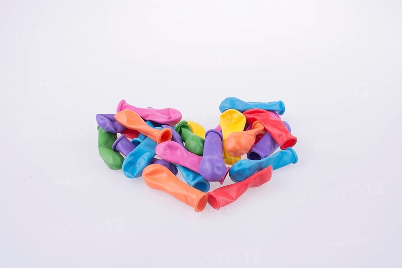 Empty color balloons forming a Heart shape on a white background