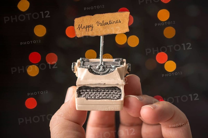 Valentine's day wording on torn typewriter as Love concept