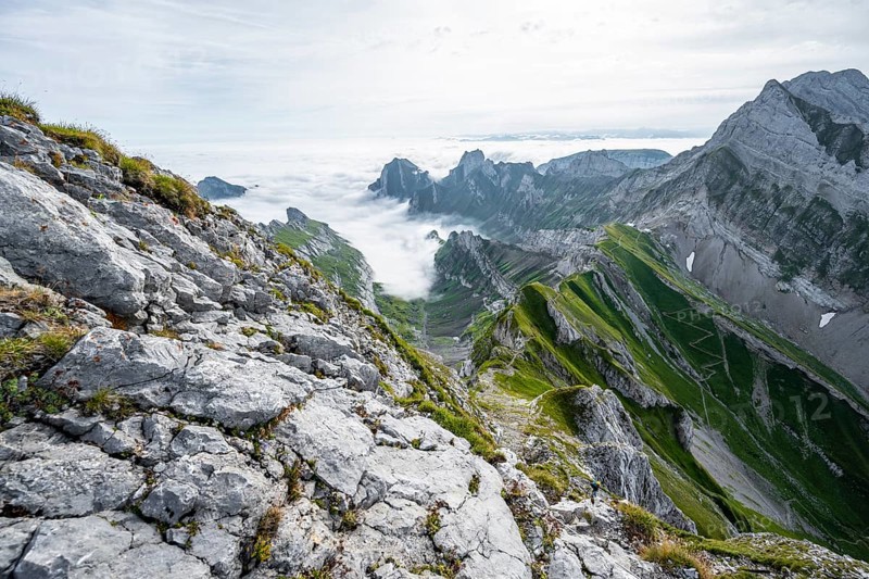 View of mountain peaks above the sea of clouds and Rotsteinpass