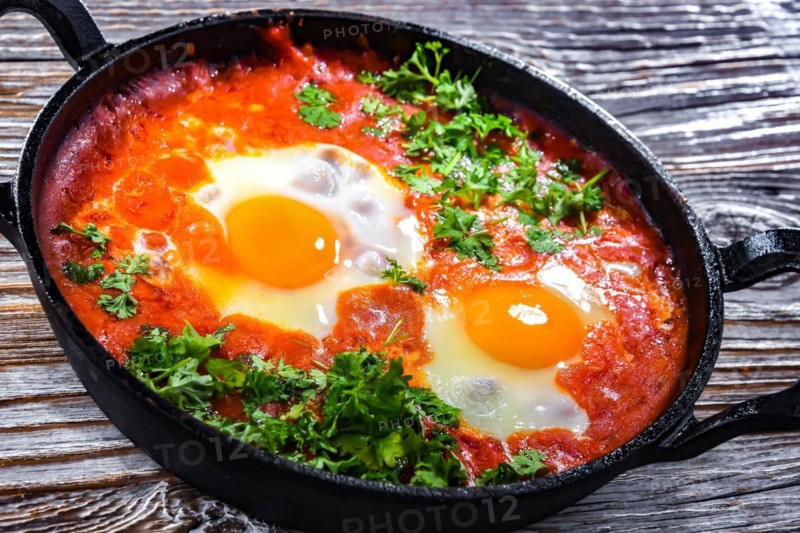 Shakshouka dish in a cast iron pan