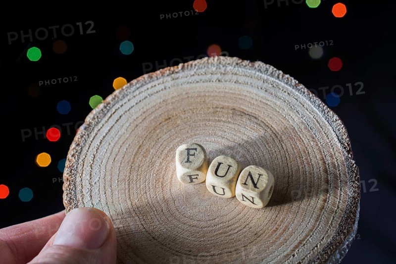 Fun wording in hand cubes bokeh lighton a dark background