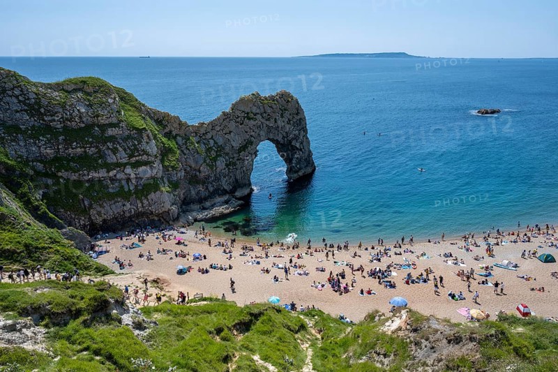 Bathing beach at the famous rock bridge Durdledoor