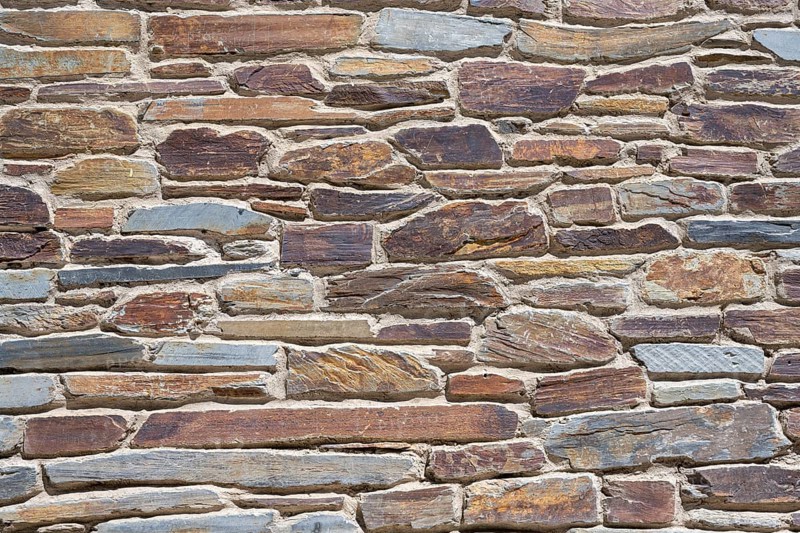 Slate slabs stacked to form a house wall