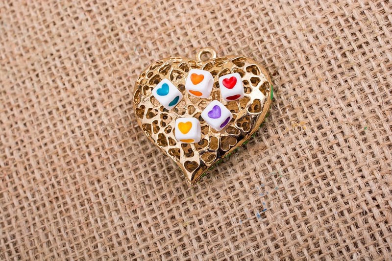 Heart cubes on Heart shaped gold color object