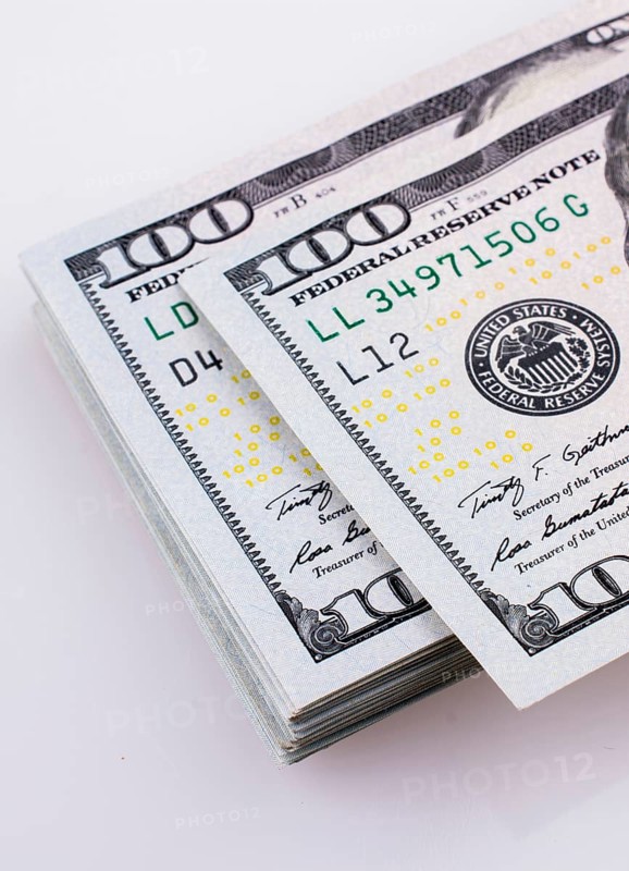 American 100 dollar banknotes made of paper placed on white background
