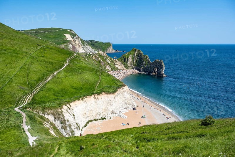 View over the chalk coast with the famous rock bridge Durdledoor