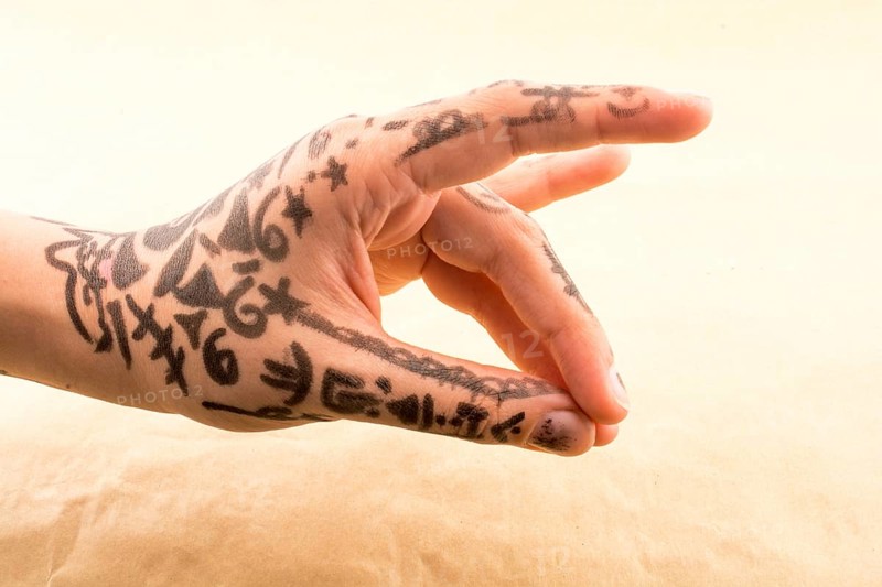 Hand with tattoo on a background