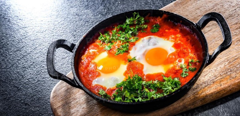 Shakshouka dish in a cast iron pan