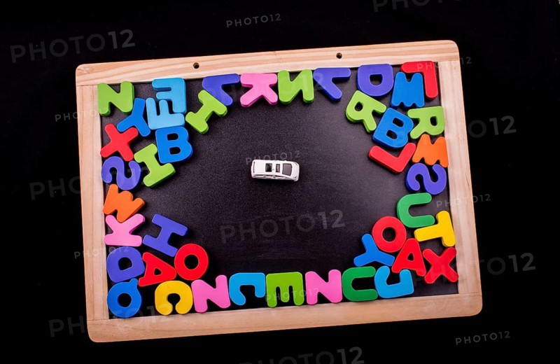 Car and Colorful Letters of Alphabet made of wood