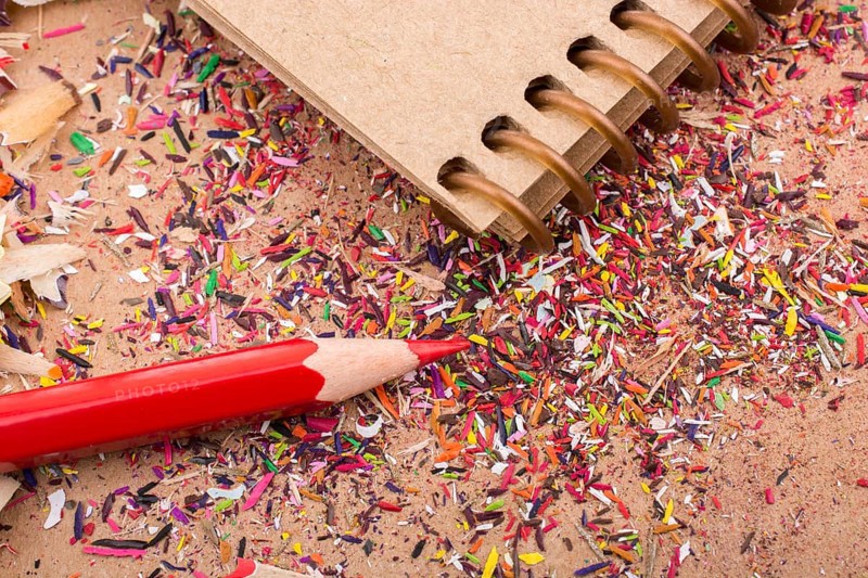 Red Color Pencil over some pencil shavings