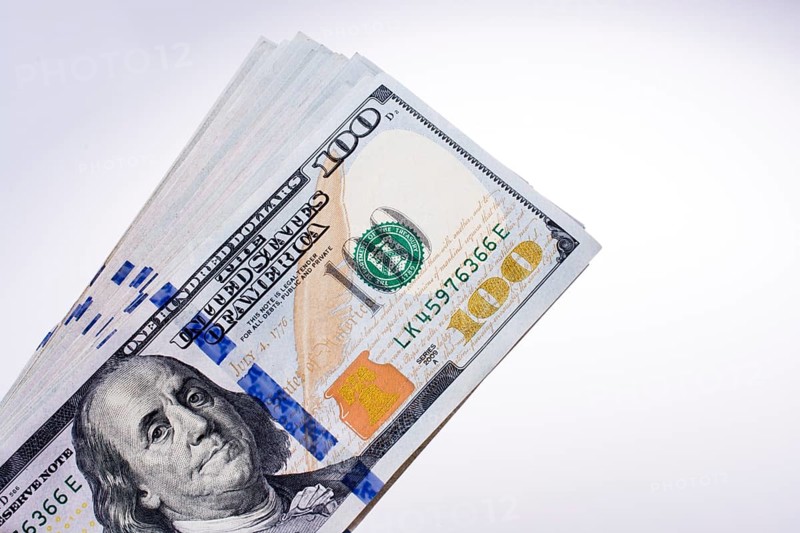 American 100 dollar banknotes made of paper placed on white background