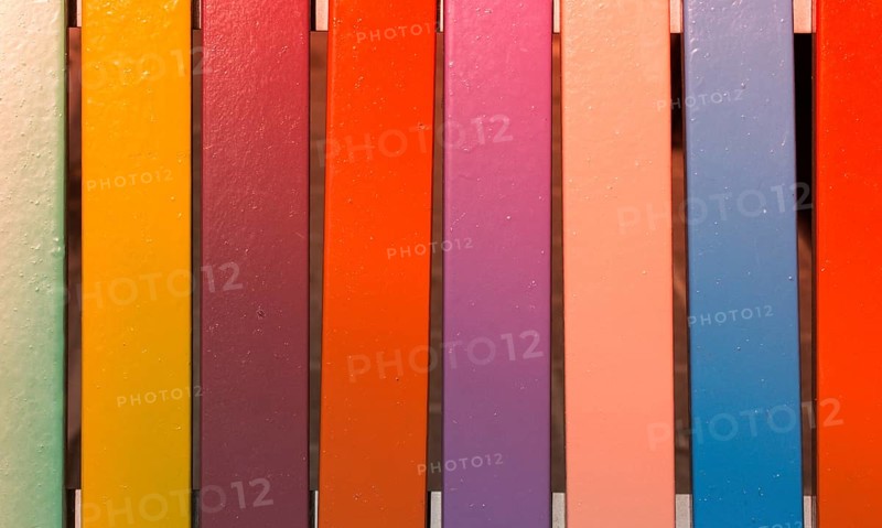 Colorful vintage pattern background on wooden parquet planks