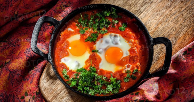 Shakshouka dish in a cast iron pan