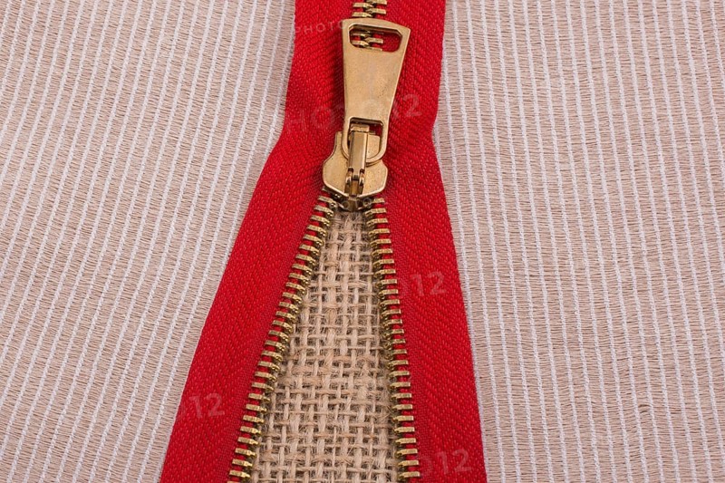 Closeup of a colorful zipper with metal teeth